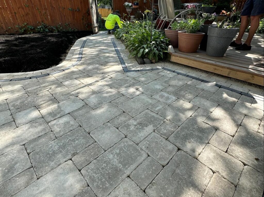Custom brick driveway design by Odd Jobs Landscape & Pavers